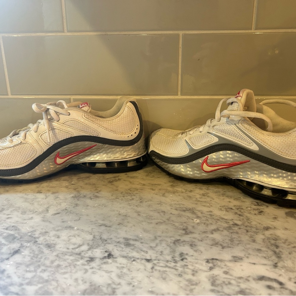 Nike (women’s)  White and Black Sneakers with Pink Accents